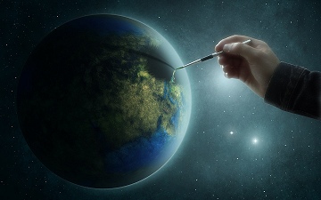 El planeta Tierra y una mano con un pincel pintando sobre l